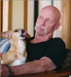  ?? COURTESY BRUCE GOMEZ ?? Ron Hagg relaxing with his dog Bailey. After Hagg’s passing, Bailey is being cared for by family members.