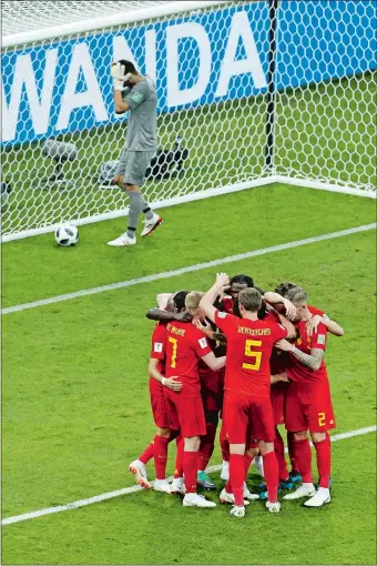  ?? VICTOR R. CAIVANO/AP PHOTO ?? Belgium players celebrate their second goal as Panama goalkeeper Jaime Penedo, top, picks the ball inside the goal during Belgium’s 3-0 victory on Monday in Sochi, Russia.