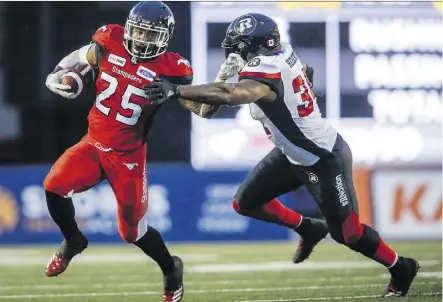  ?? JEFF MCINTOSH/THE CANADIAN PRESS ?? The Redblacks’ Kyries Hebert, right, takes exception for what he believes is a double standard regarding helmet hits in today’s CFL. He says defensive players tend to be targeted while offensive players who initiate contact with their helmets are given...