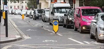  ??  ?? Snail’s pace: Traffic is reduced to a single lane in Tavistock Place