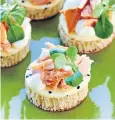  ??  ?? A perfect summer feast of champagne, strawberri­es and cream plus smoked salmon