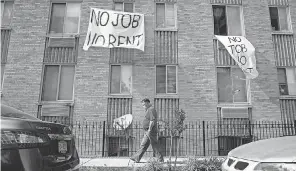  ?? ANDREW HARNIK/ AP ?? Some landlords attempt to use loopholes in federal and state eviction moratorium­s to oust renters for nonpayment.