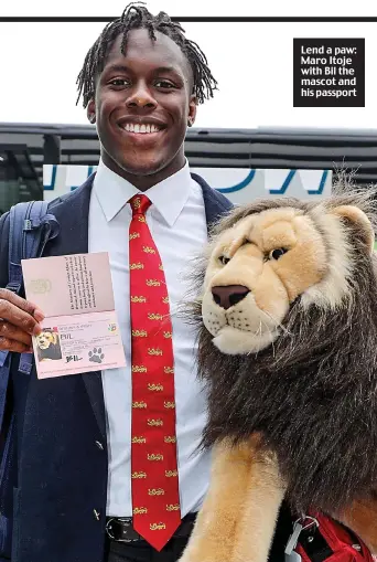  ??  ?? Lend a paw: Maro Itoje with Bil the mascot and his passport