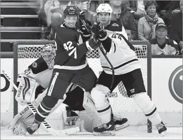  ?? FRANK GUNN/THE CANADIAN PRESS VIA AP ?? Boston goaltender Tuukka Rask (40) looks for the puck as Bruins defenseman Nick Holden (44) and Toronto center Tyler Bozak (42) battle in front of his net during third period of the Maples Leafs’ 4-2 victory in Game 3 of their NHL playoff series on...