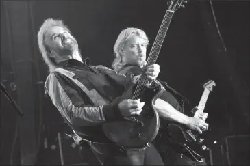  ?? Photo by Richard Amery for The Herald ?? 38 Special lead singer Don Barnes and lead guitarist Danny Chauncey perform one of their many hits for a crowd of more than 3,000 people at the Exhibition Park Grandstand during Whoop-Up Days Wednesday night.