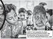  ??  ?? Lalit is ‘very popular in class and everyone is fond of him,’ the headmaster of his government­run school, Babulal Makwana, said