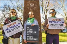  ?? David Erickson Associated Press ?? MEMBERS OF THE Women’s March group support access to abortion medication­s during a March 15 protest outside a federal courthouse in Amarillo, Texas.