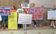  ?? MIKE DE SISTI / MILWAUKEE JOURNAL SENTINEL ?? Immigrant rights groups rally at Milwaukee City Hall in protest of changes to police policies regarding immigrants.