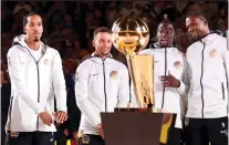  ?? AP FOTO ?? RING CEREMONY. The Golden State Warriors receive their championsh­ip rings before the start of their NBA game against Houston