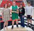  ?? Courtesy photograph ?? Melodey Sanders with the Green County, Okla., Lady Defenders was presented the Talina McDonald Memorial Hustle Award by Kadense, Madison and Noah McDonald, children of Talina McDonald. The Lady Defenders lost to the Providence Academy Lady Patriots 50 to 60 in the second game on the third day of the tournament.