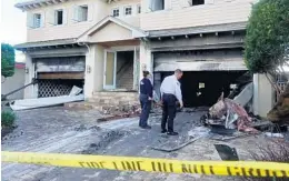  ?? JOE CAVARETTA/SUN SENTINEL ?? Officials inspect damage to the home in Fort Lauderdale’s Rio Vista neighborho­od.