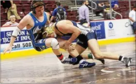  ?? ROD JAMES - FOR DIGITAL FIRST MEDIA ?? Exeter’s Tyler Fisher, right, takes down Northern Lebanon’s Ethan Herb during the consolatio­n semifinals at the District 3 AA Championsh­ips on Feb. 25 in Hershey. Fisher placed fourth at 170.