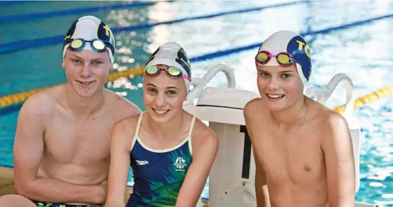  ?? Photos: Kevin Farmer ?? STATE TITLES: Swimmers (from left) Henry Reardon, Hannah Pollock and Hugh Pollock will be part of Toowoomba Grammar Swimming Club’s big team heading to the state championsh­ips later this month.