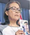  ?? JUSTIN TANG CP ?? Debbie Baptiste, mother of Colten Boushie, holds a photo of her son during a news conference on Parliament Hill in Ottawa on Feb. 14, 2018.•