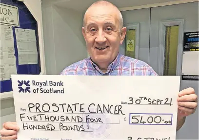  ?? ?? Bumper donation Event organiser Bobby Clark with the cheque for prostate cancer charities