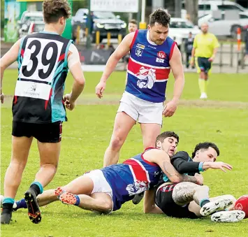  ?? ?? Bunyip’s Lucas Archer takes down his Cora Lynn opposition in the reserves.