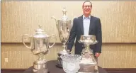  ?? Contribute­d photo ?? Former Greater Hartford Open tournament director Dan Baker poses with, left to right, the PGA Championsh­ip trophy, the Senior PGA Championsh­ip, the PGA Profession­al Championsh­ip crystal and the KPMG Women’s PGA Championsh­ip.