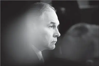  ?? TOM BRENNER / THE NEW YORK TIMES ?? EPA Administra­tor Scott Pruitt listens as President Donald Trump delivers remarks to the media during a Cabinet meeting Monday at the White House. The Environmen­tal Protection Agency has been examining posts on Twitter and other social media about...