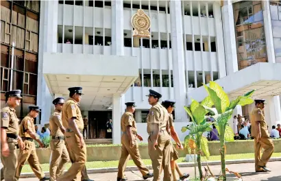  ??  ?? Police are seen leaving the Supreme Court premises on Friday.