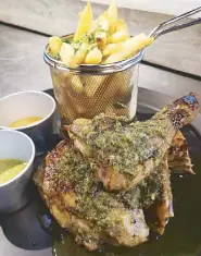  ??  ?? Piri-piri chicken is marinated and basted in chef Paeng’s secret recipe, grilled then served with a side of French fries.