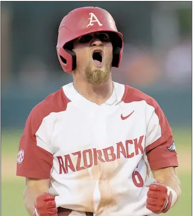  ?? NWA Democrat-Gazette/ANDY SHUPE ?? Arkansas first baseman Hunter Wilson celebrates after arriving safely at third base on Eric Cole’s two-run single in the fifth inning of the Razorbacks’ 9-3 victory victory over Texas A&amp;M on Friday night at Baum Stadium in Fayettevil­le.