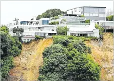  ?? Picture: NEWS.COM.AU ?? Houses on the cliffs are teetering over the edge, as fearful residents await more heavy rain.
