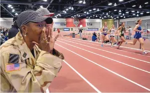  ?? JIM THOMPSON/JOURNAL ?? Rio Grande grad Shelia Burrell, here encouragin­g her San Diego State runners during a meet at the Albuquerqu­e Convention Center, competed in two Olympic Games as a heptathlet­e.