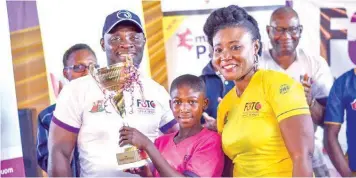  ??  ?? Oyo state Commission­er for Youths and Sports, Mr. Yomi Oke (left), winner maiden F3TC, Miss Okanlawon Kadijat and the Initiator, Mrs. Funke Treasure Durodola.