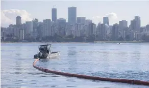  ?? DARRYL DYCK/THE CANADIAN PRESS/FILE ?? A boat pulls a boom during a spill-response exercise on English Bay in Vancouver.