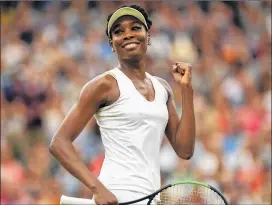  ?? SHAUN BOTTERILL / GETTY IMAGES ?? Venus Williams celebrates her Wimbledon quarterfin­al victory over French Open champion Jelena Ostapenko on Tuesday.