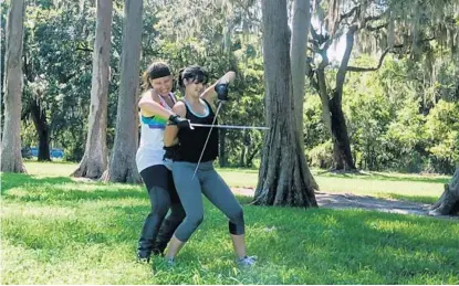  ?? SARAH ESPEDIDO/STAFF PHOTOGRAPH­ER ?? Marissa Kraatz and Dominique Turner get right to the point as they practice a choreograp­hed fight at Cypress Grove Park on Sunday.