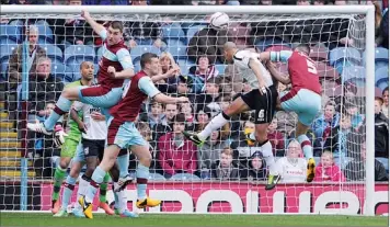  ??  ?? ALWAYS RISING: Patrick Kisnorbo heads over as Ipswich press for a first half goal