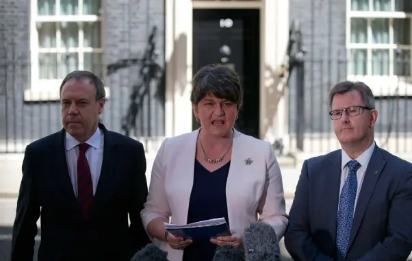  ??  ?? ANGER: DUP leader Arlene Foster addresses the media, flanked by deputy leader Nigel Dodds (left) and MP Jeffrey Donaldson, outside 10 Downing Street