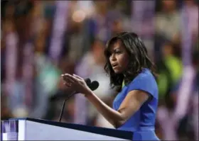  ?? ASSOCIATED PRESS ?? First Lady Michelle Obama speaks during the first day of the Democratic National Convention in Philadelph­ia on Monday.