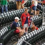  ??  ?? Atlanta Braves fans linger at SunTrust Park on Monday night, finding it hard to leave behind a magical 2018 season that ended Monday night with a 6-2 loss to the Los Angeles Dodgers in Game 4 of their National League Division Series.