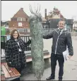  ??  ?? IT’S A GIFT Stephanie
Hall of Milton Park Primary accepts a donated tree fromd Leaders Estate Agents Southsea branch manager Dave Sibley