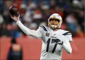  ?? DAVID ZALUBOWSKI - THE ASSOCIATED PRESS ?? FILE - In this Dec. 1, 2019, file photo, Los Angeles Chargers quarterbac­k Philip Rivers passes against the Denver Broncos during the second half of an NFL football game in Denver. The Indianapol­is Colts and longtime Los Angeles Chargers star quarterbac­k Philip Rivers have worked out a one-year contract.