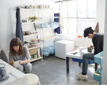  ??  ?? Jen Collins, left, and Shayna Stevenson work on ceramics for their business, Keep Company, at the Akin Collective.