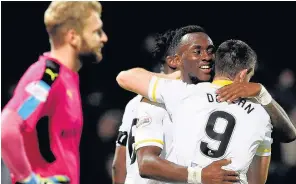  ??  ?? PAR FOR COURSE Ade Azeez and Kris Doolan celebrate as they beat Dundee in October