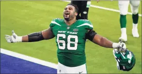  ?? Ashley Landis / Associated Press ?? New York Jets offensive guard Josh Andrews celebrates after a win over the Los Angeles Rams during an NFL game on Sunday in Inglewood, Calif. The Jets won 23-20 for their first win of the season.