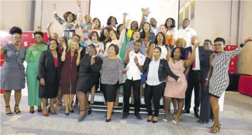  ?? ?? The 2022 cohort of the Scotiabank Vision Achiever programme celebrate the end of their 17-week business transforma­tion programme with executives from Scotiabank, Actioncoac­h Jamaica and 2022 sponsors.