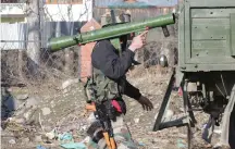  ?? (Younis Khaliq/Reuters) ?? AN INDIAN ARMY soldier carries a rocket launcher yesterday near a gun battle between suspected terrorists and Indian security forces in Kashmir’s Pulwama district.