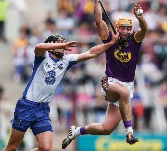  ??  ?? Eoin Moore puts his best foot forward to win possession ahead of Waterford’s Páuric Mahony.