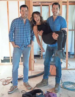  ??  ?? Jonathan Scott, left, his brother, Drew, and Drew’s fiancé, Linda Phan, get carried away with “Drew’s Honeymoon House.” ROBERT HANASHIRO, USA TODAY