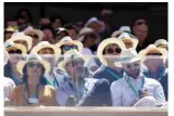  ?? — AFP ?? PARIS: In this file photo taken on June 2, 2019, members of the audience watch the men’s singles fourth round match between Argentina’s Leonardo Mayer and Switzerlan­d’s Roger Federer on day eight of The Roland Garros 2019 French Open tennis tournament in Paris.