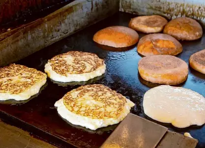  ?? John Storey/Special to the Chronicle ?? Lemon ricotta pancakes cook on the flattop at Plow Restaurant in San Francisco in 2012.