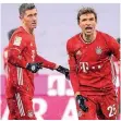  ?? FOTO: SVEN HOPPE/DPA ?? Lewandowsk­i und Müller jubeln über das Tor zum 2:1.