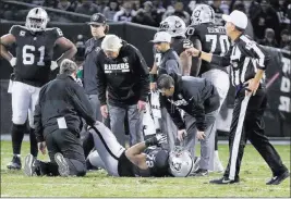  ?? Heidi Fang ?? Las Vegas Review-journal @Heidi Fang Raiders training staff look over offensive tackle Donald Penn after he suffered ligament damage to his right foot in the second quarter of Sunday night’s 20-17 loss to the Dallas Cowboys in Oakland, Calif.