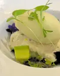  ??  ?? Kraby, crab mousse on a bed of leafy greens and cubed avocado crowned with roasted pineapple sorbet