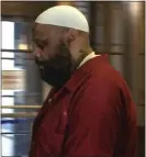  ?? CARL HESSLER JR. — MEDIANEWS GROUP ?? Anthony McDaniels, of Philadelph­ia, is escorted from Montgomery County courtroom to begin serving 15-to-30-year prison term for role in burglary spree.